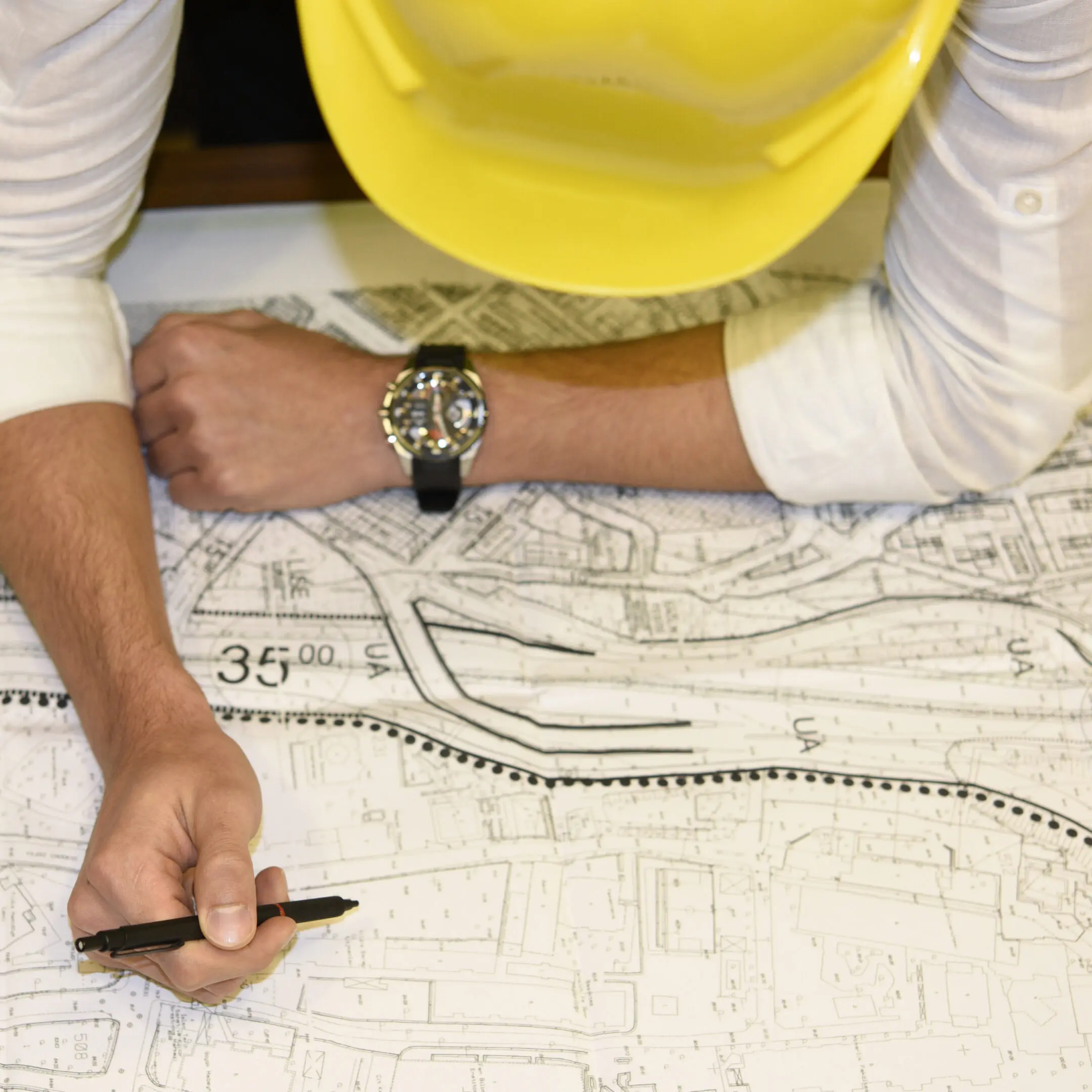 Architect examining building plans