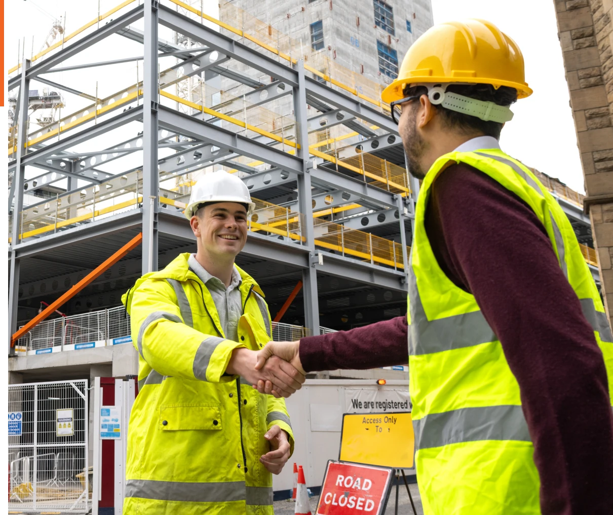 Engineers in hard hats at construction area
